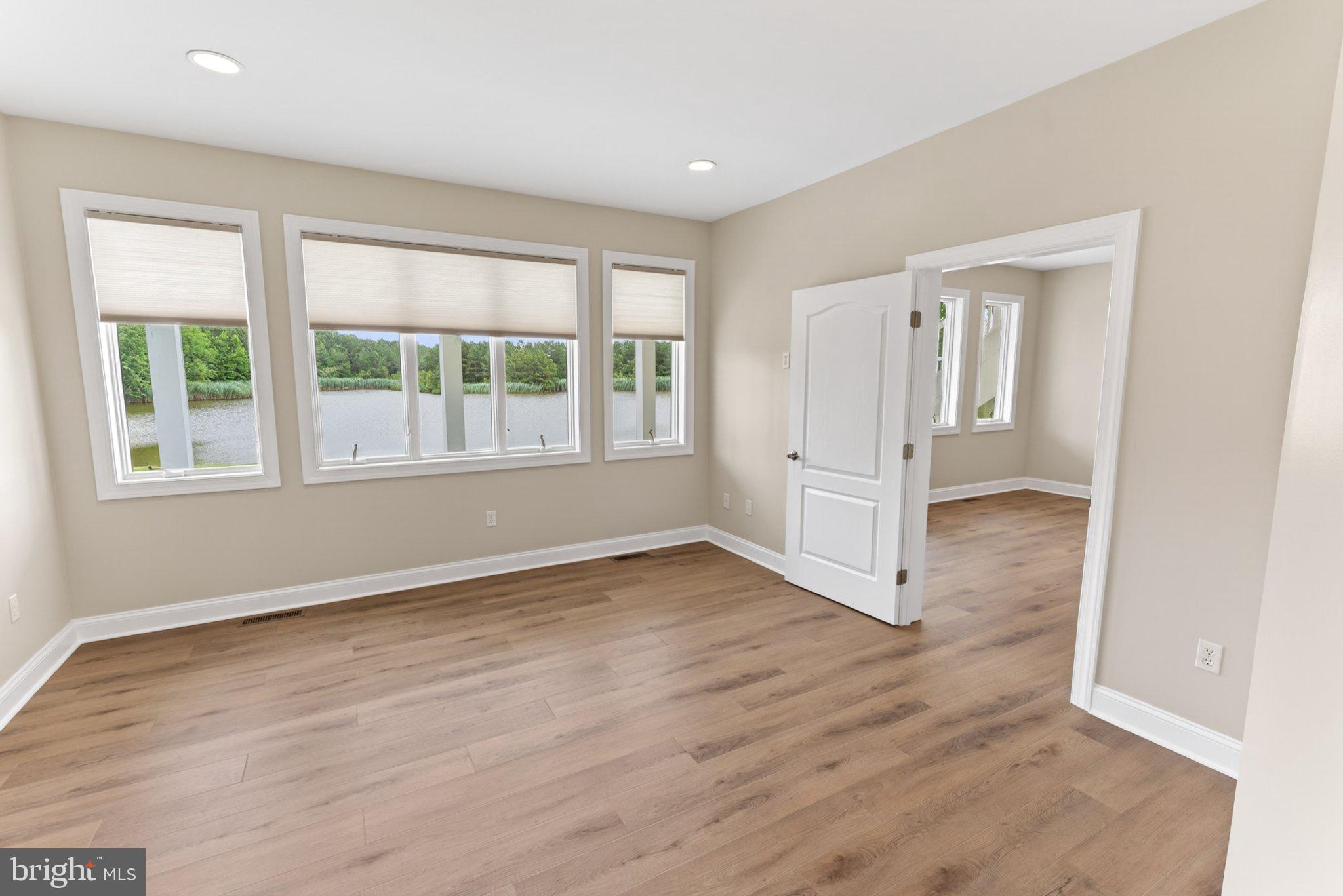 34029 Peppers Corner Road Millville, DE 19967 - Photo 26 of 101 Bright, airy space with serene views.