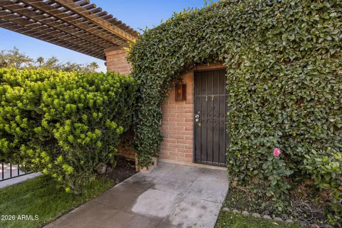 front view of a house with a tree