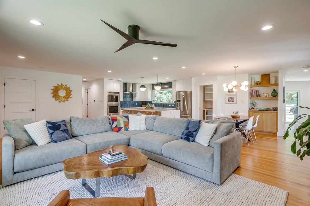 6700 Fortune Road Fort Worth, TX 76116 - Photo 15 of 40 Open-concept living space featuring wood-finish flooring, recessed lighting, and a contemporary ceiling fan