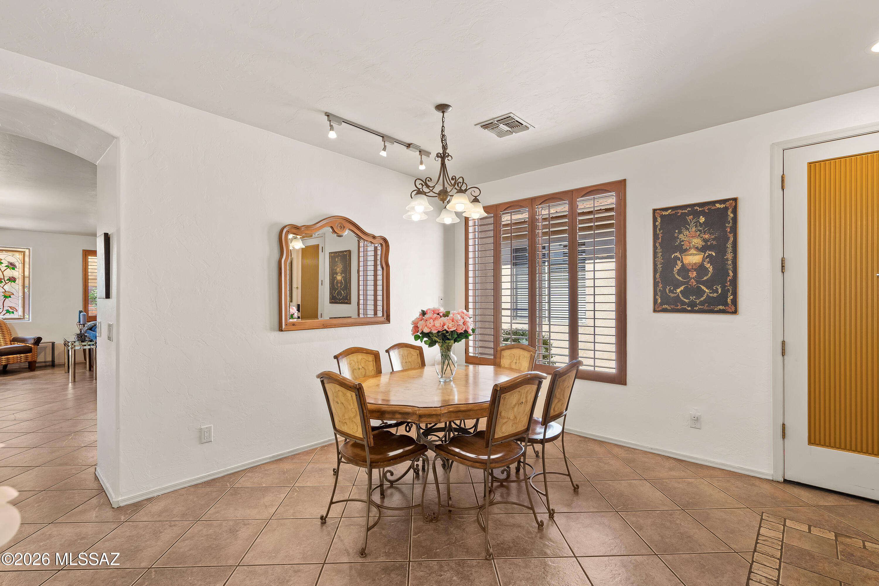 3396 North Camino Rio Colorado Tucson, AZ 85712 - Photo 6 of 32 a view of a dining room with furniture and chandelier