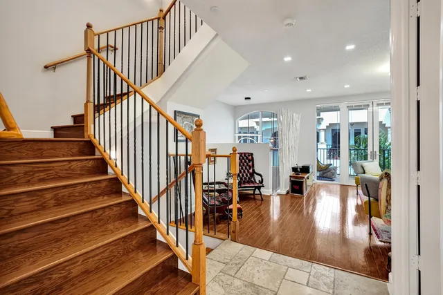 a living room with furniture and a painting on the wall