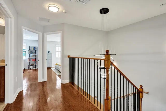 a living room with furniture and a book shelf
