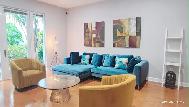 a living room with furniture and a large window