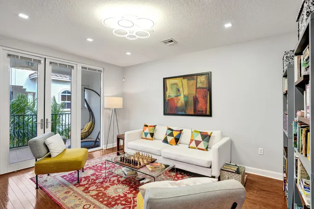 a kitchen with stainless steel appliances granite countertop a sink a stove a microwave and cabinets