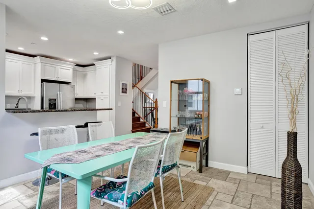 a view of a livingroom with furniture and hardwood floor
