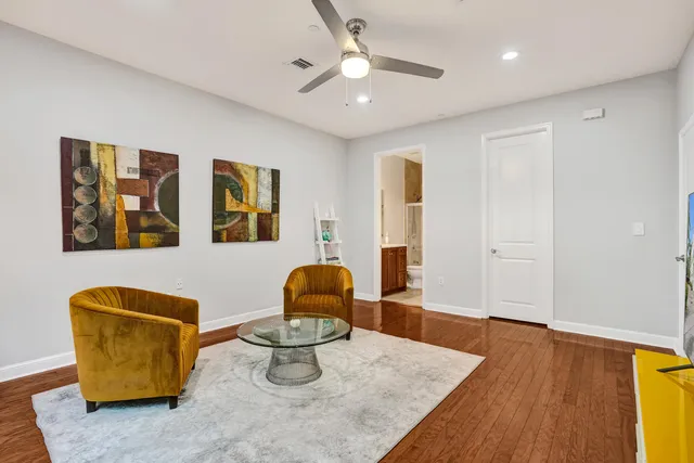 a view of a balcony with chair and flower pot