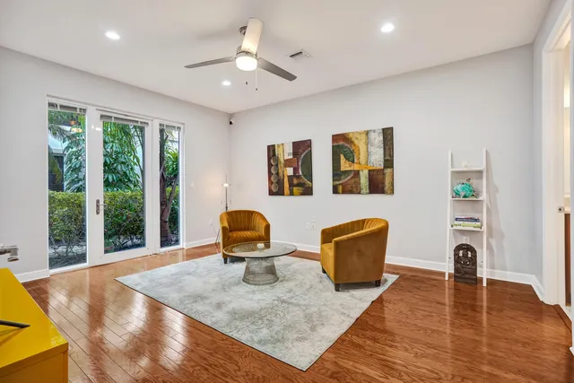 a living room with lots of furniture and a rug