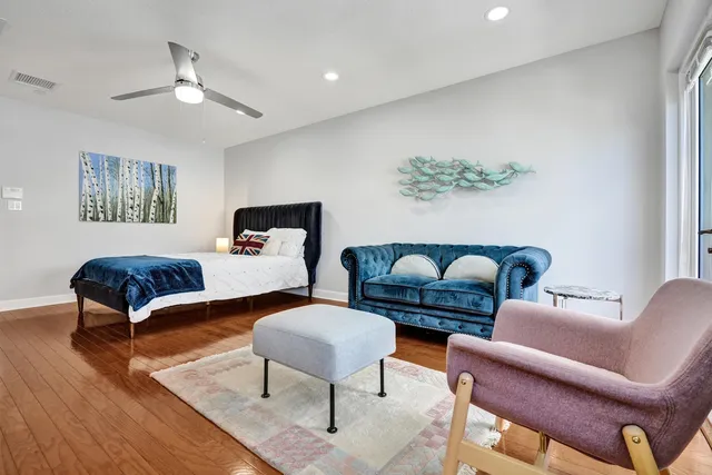 a bedroom with bed and a table