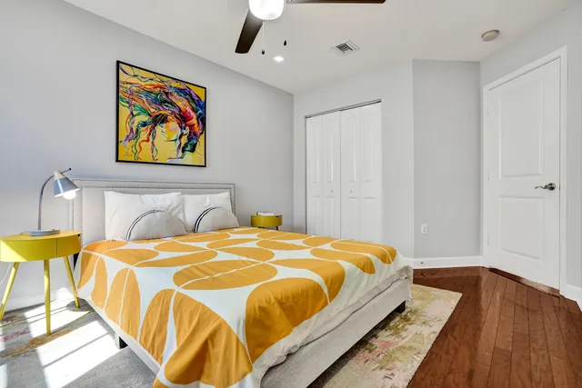 a front view of a house with plants