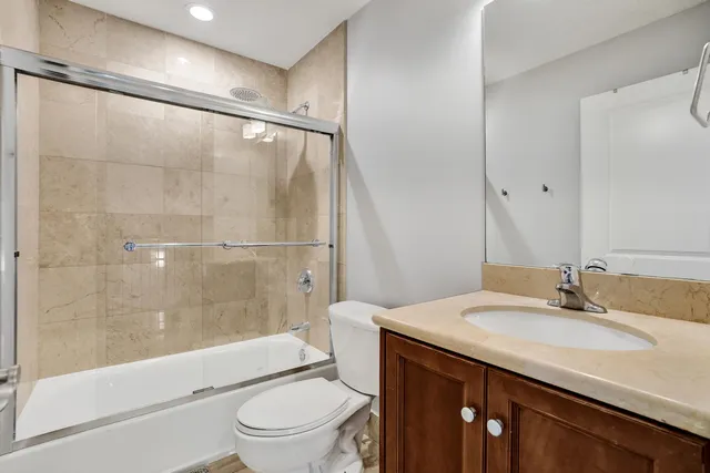 an aerial view of residential houses with outdoor space and street view