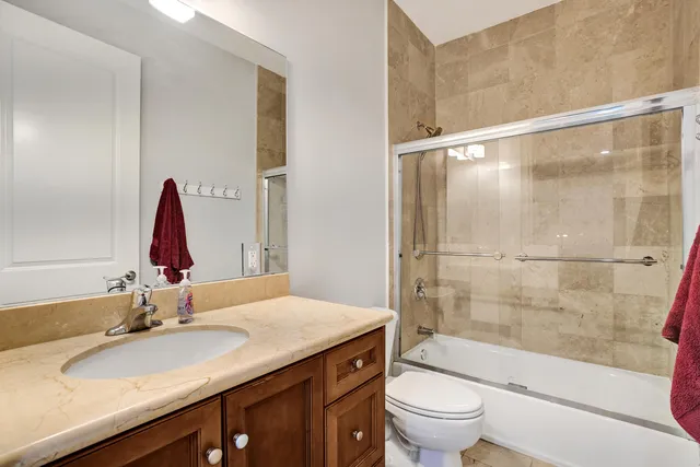 an aerial view of residential house with outdoor space and lake view