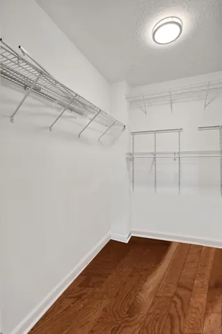 a front view of a house with plants