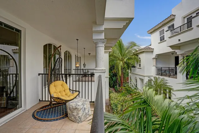 a living room with furniture and a dining table