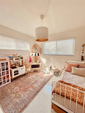 a bedroom with furniture and a table