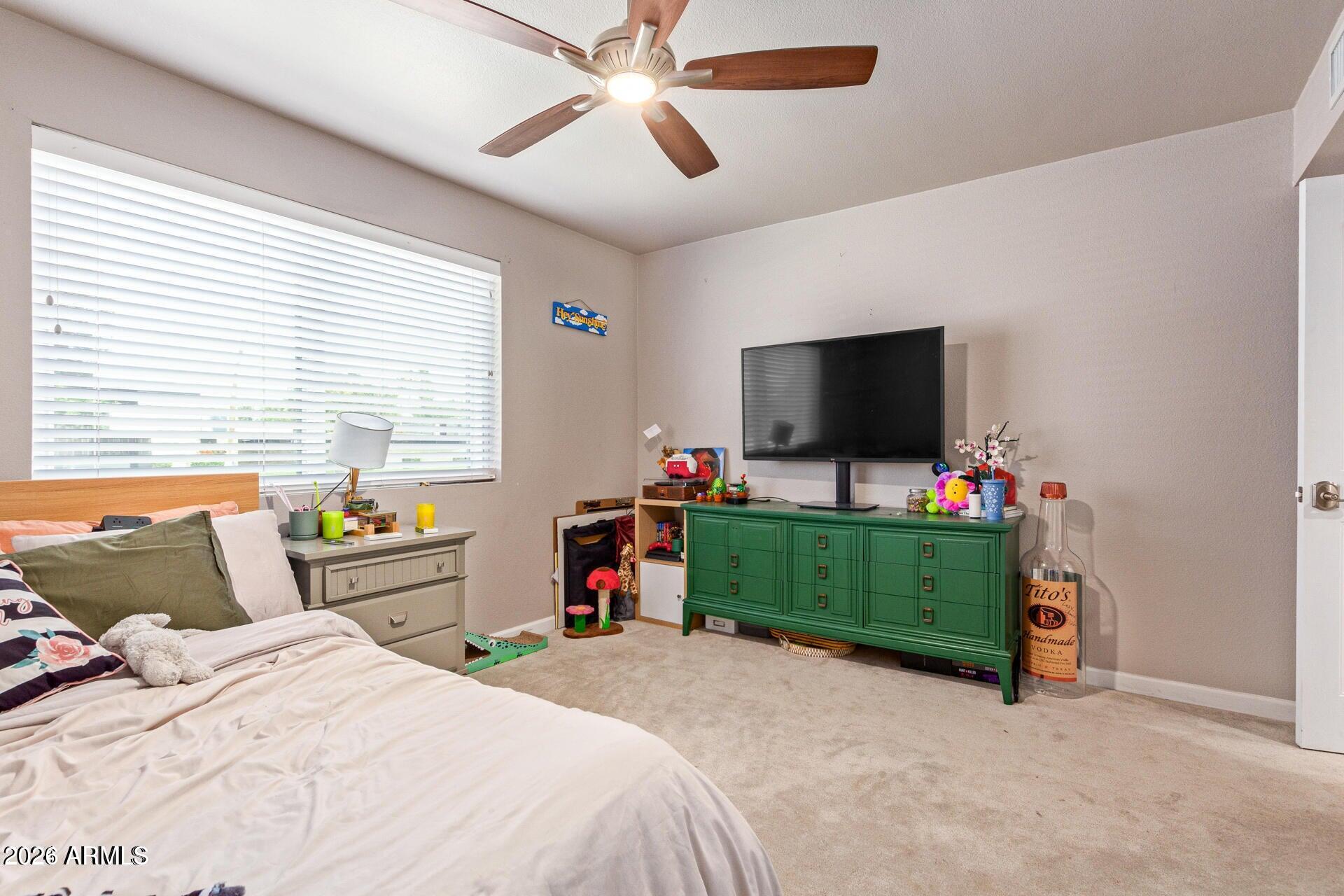 5913 East Thomas Road Scottsdale, AZ 85251 - Photo 23 of 26 a bedroom with bed and tv
