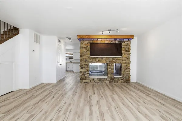 a view of livingroom with furniture and flat screen tv