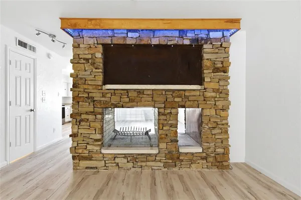 a living room with fireplace furniture and a flat screen tv