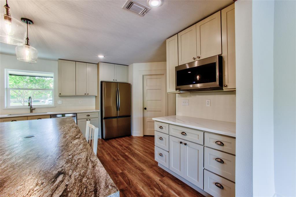 206 Americana Road Palmer, TX 75152 - Photo 14 of 40 Accommodating Coffee Bar Spot under the Built-in Microwave