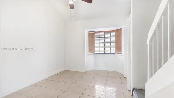 a view of an empty room with windows