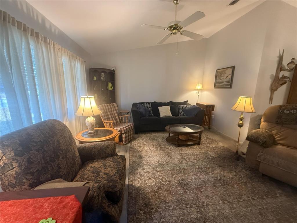 11263 Southwest 138th Lane Dunnellon, FL 34432 - Photo 12 of 25 a living room with furniture and a window