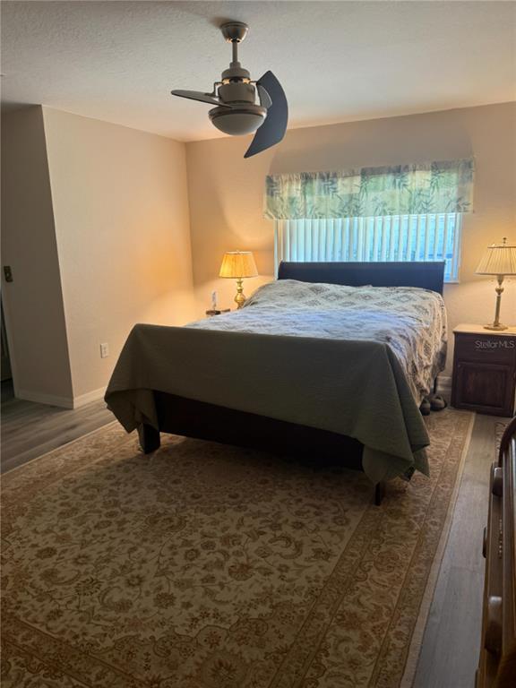 11263 Southwest 138th Lane Dunnellon, FL 34432 - Photo 15 of 25 a bed sitting in a bedroom next to a window