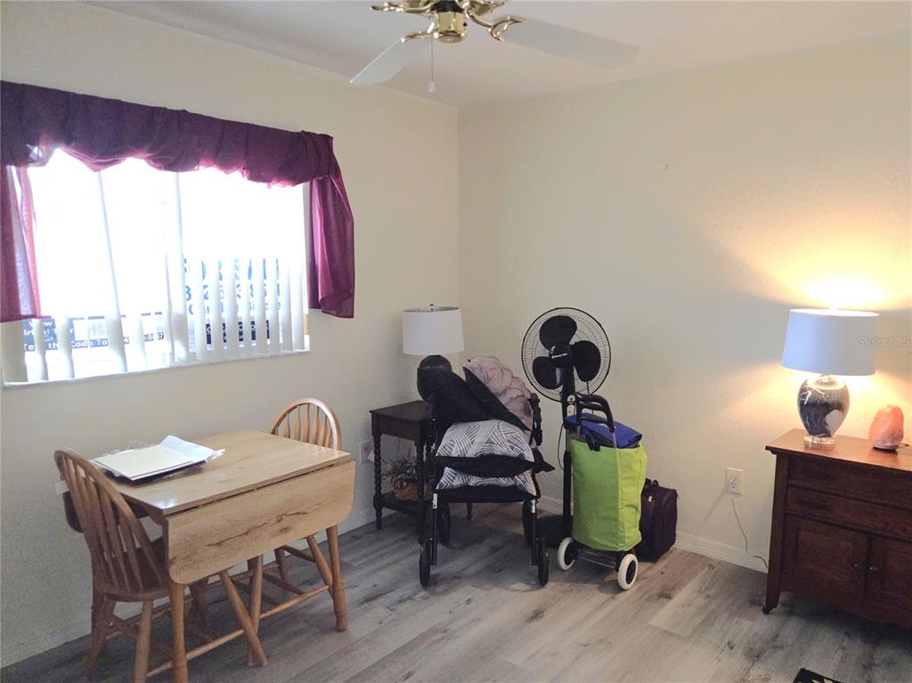 11263 Southwest 138th Lane Dunnellon, FL 34432 - Photo 18 of 25 a view of a dining room with furniture window and wooden floor