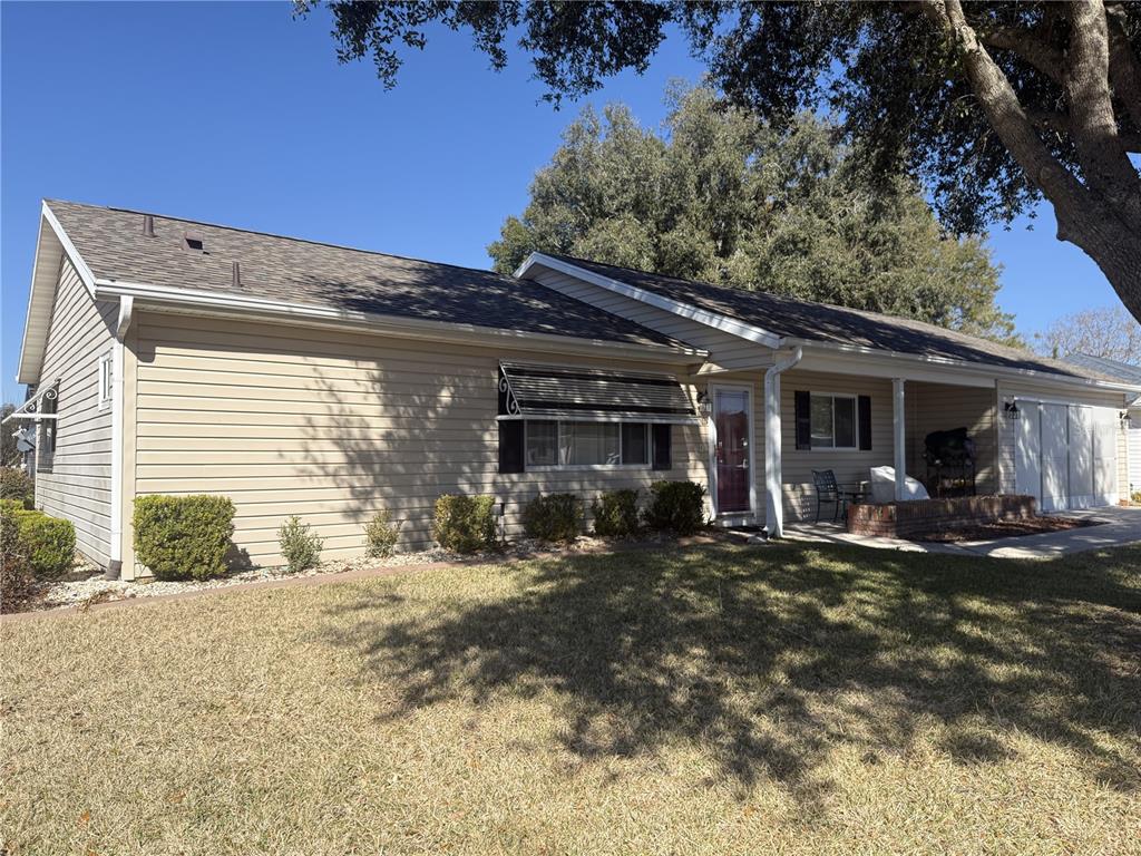 11263 Southwest 138th Lane Dunnellon, FL 34432 - Photo 2 of 25 a front view of a house with a patio