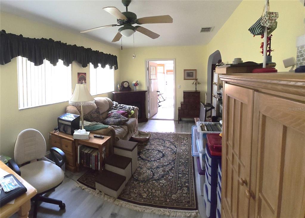 11263 Southwest 138th Lane Dunnellon, FL 34432 - Photo 21 of 25 a living room with furniture and a large window