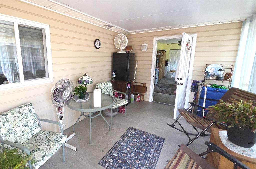 11263 Southwest 138th Lane Dunnellon, FL 34432 - Photo 23 of 25 a living room with furniture and wooden floor