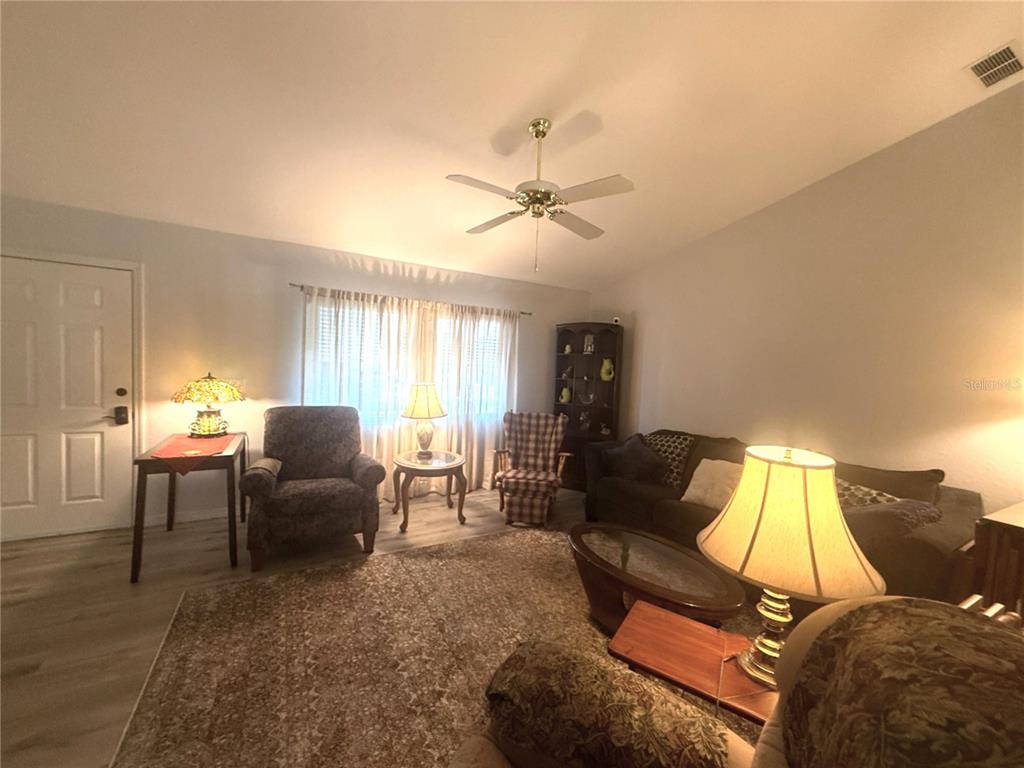11263 Southwest 138th Lane Dunnellon, FL 34432 - Photo 25 of 25 a living room with furniture and a window