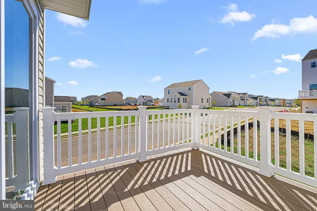 a view of a balcony with wooden floor