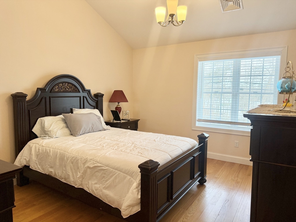 60 A Danforth Street, Unit A Taunton, MA 02780 - Photo 7 of 10 a bedroom with a bed and a table