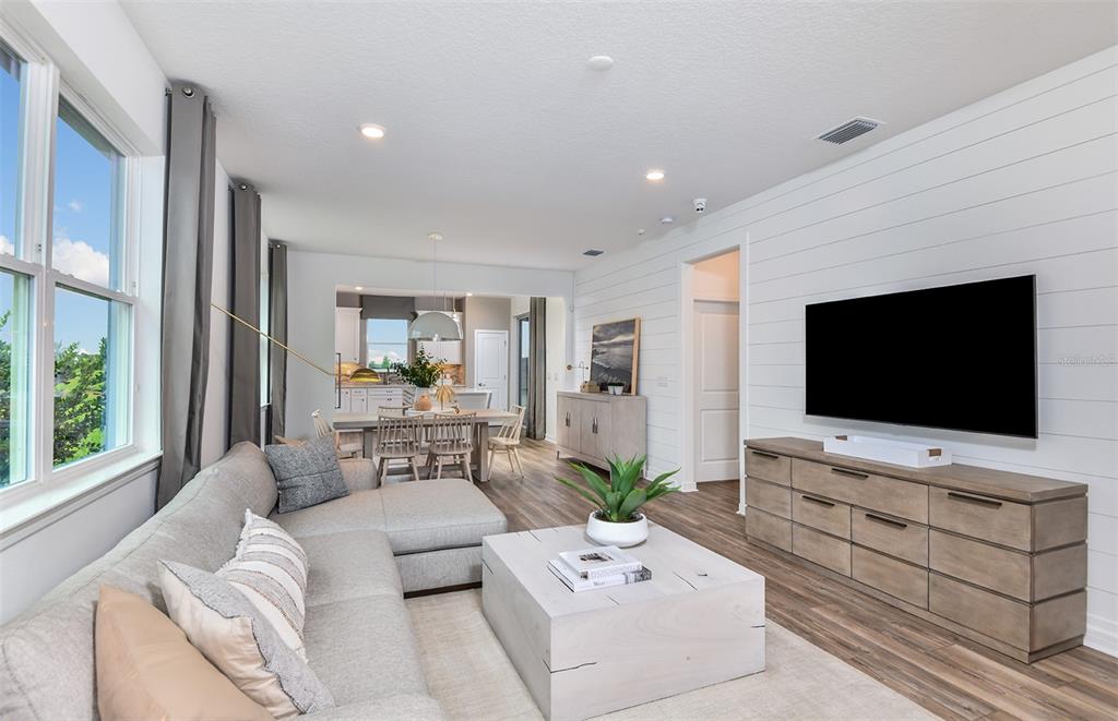 1320 Orange Vly Road Minneola, FL 34715 - Photo 5 of 23 a living room with furniture and a flat screen tv