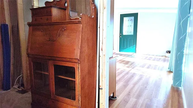 a bedroom with a bed and a mirror