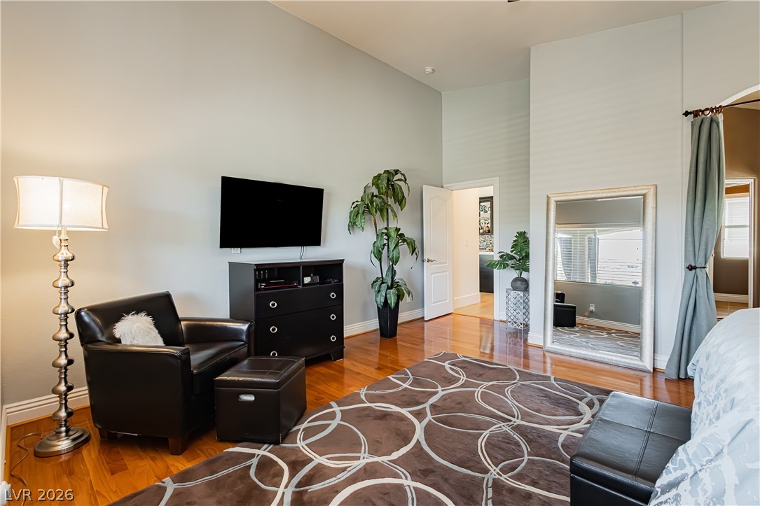 2256 Dogwood Ranch Avenue Henderson, NV 89052 - Photo 38 of 51 Hardwood floors and generous ceiling heights characterize this comfortable bedroom space.