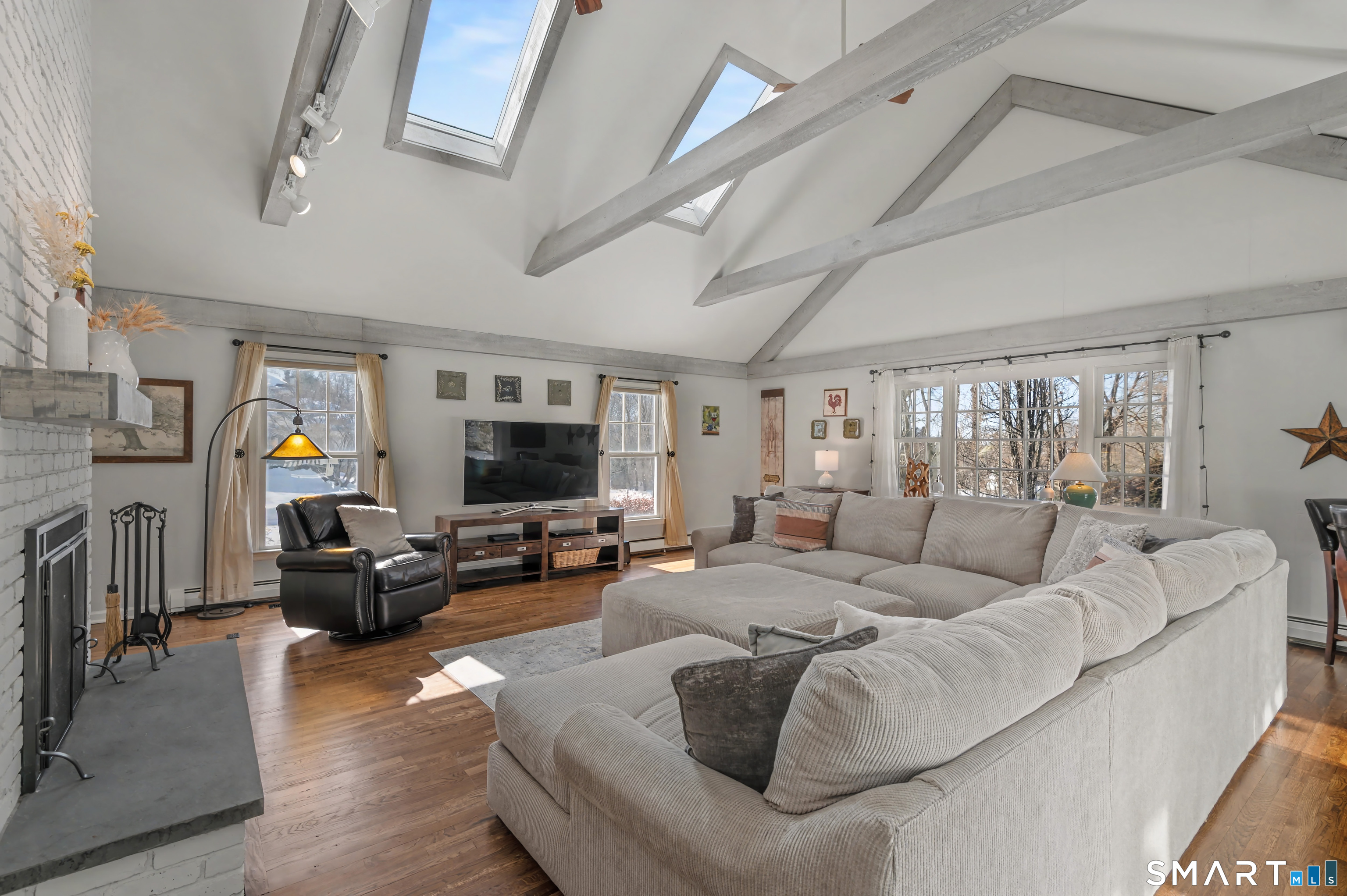 6 Sycamore Lane Ridgefield, CT 06877 - Photo 11 of 39 a living room with furniture and a flat screen tv