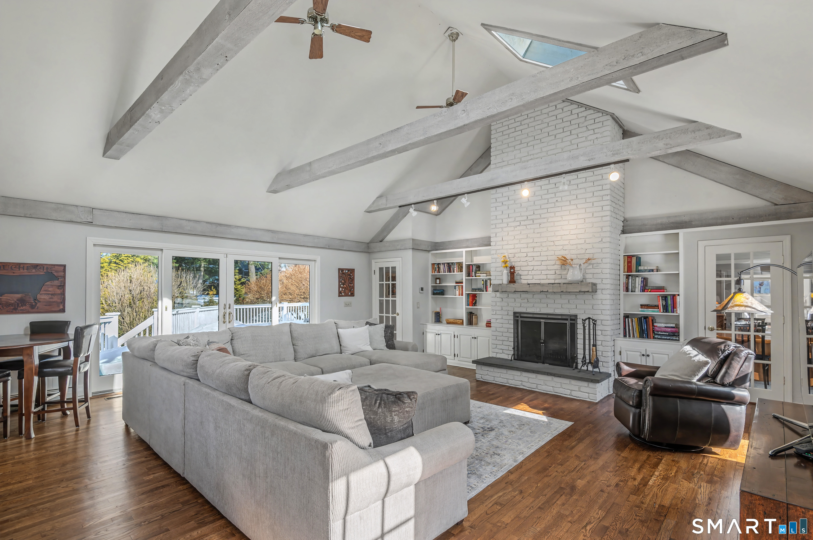 6 Sycamore Lane Ridgefield, CT 06877 - Photo 12 of 39 a living room with furniture and a fireplace