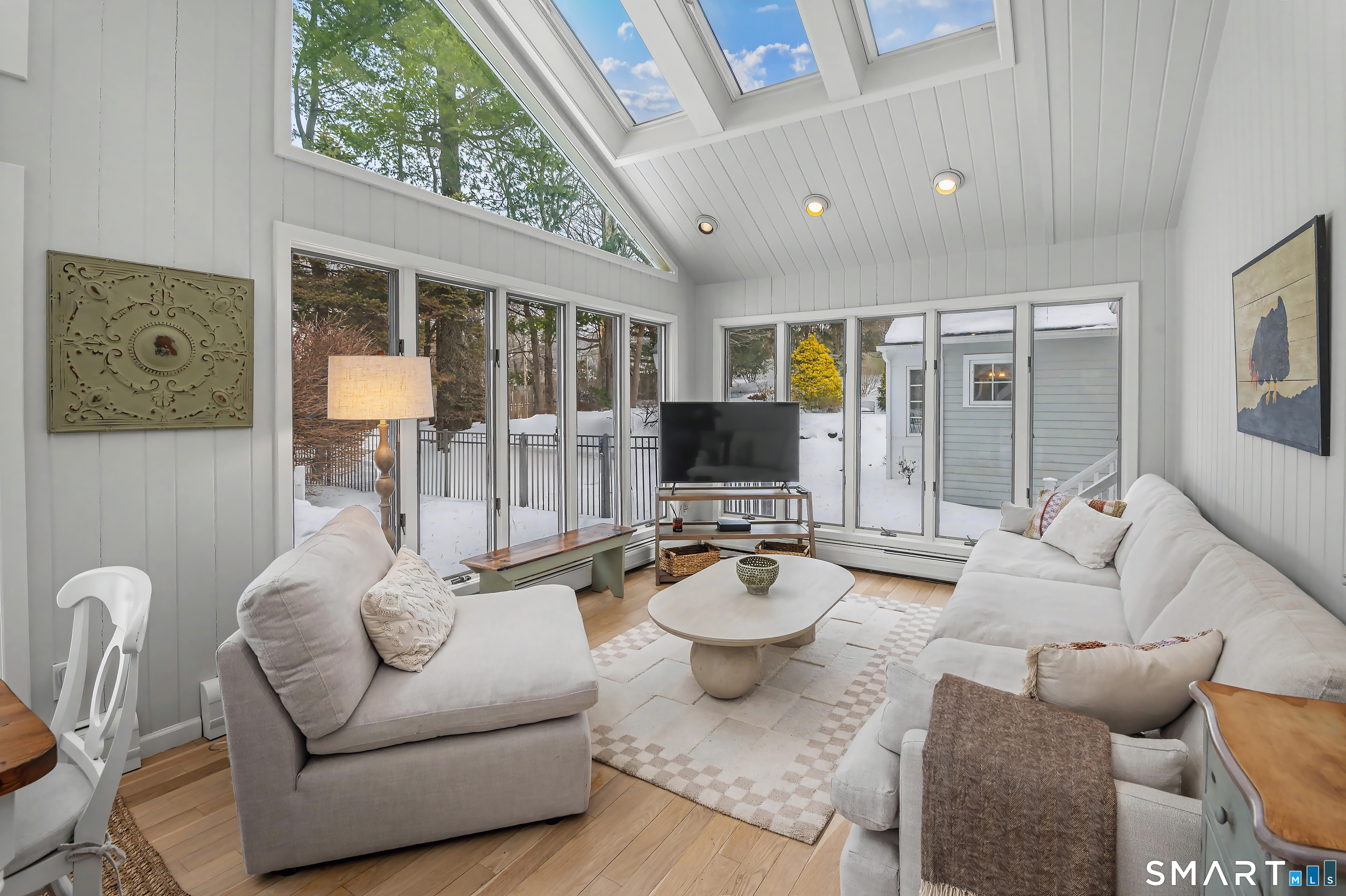 6 Sycamore Lane Ridgefield, CT 06877 - Photo 14 of 39 a living room with furniture and a flat screen tv