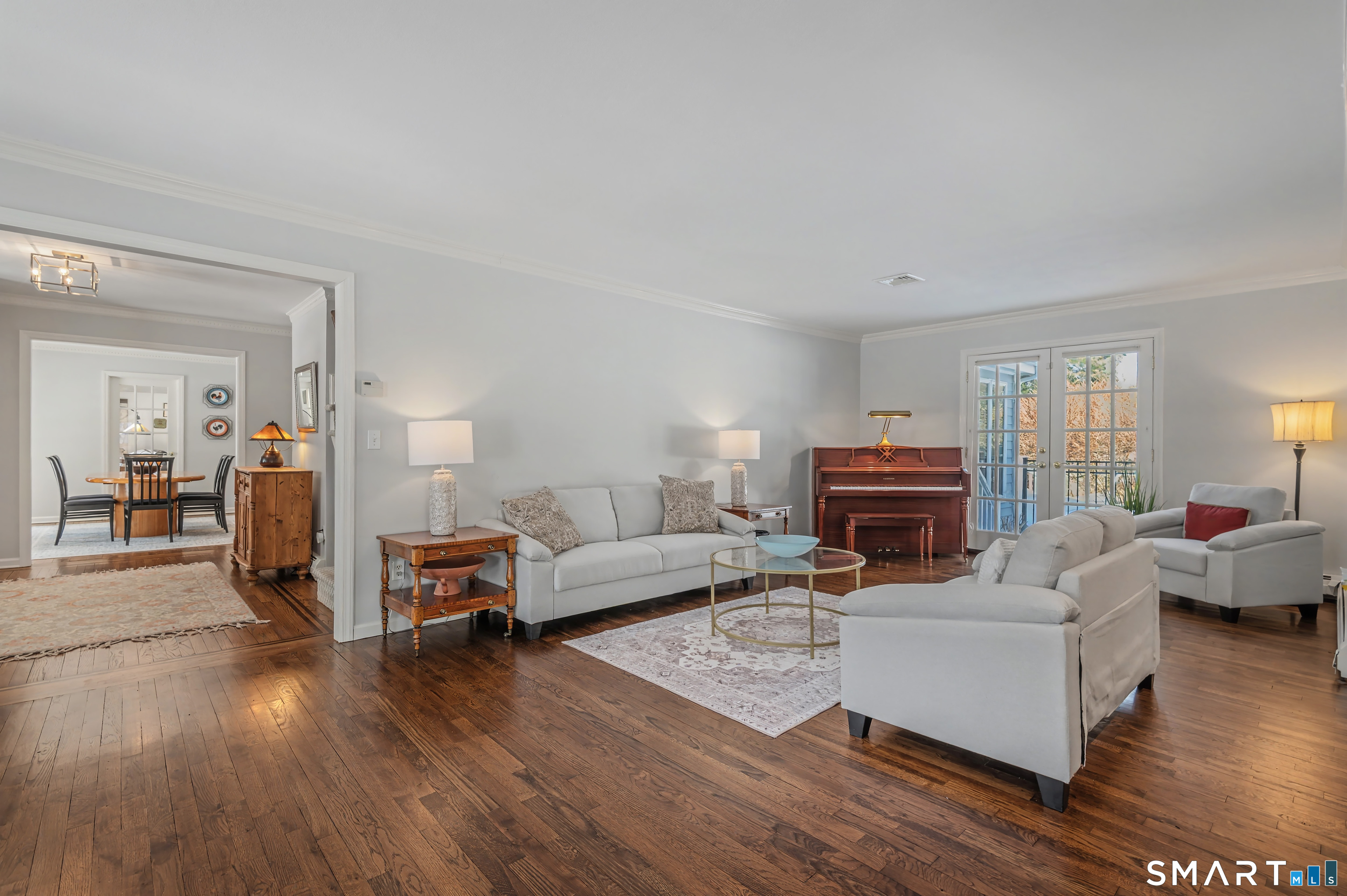 6 Sycamore Lane Ridgefield, CT 06877 - Photo 14 of 39 a living room with furniture and a wooden floor
