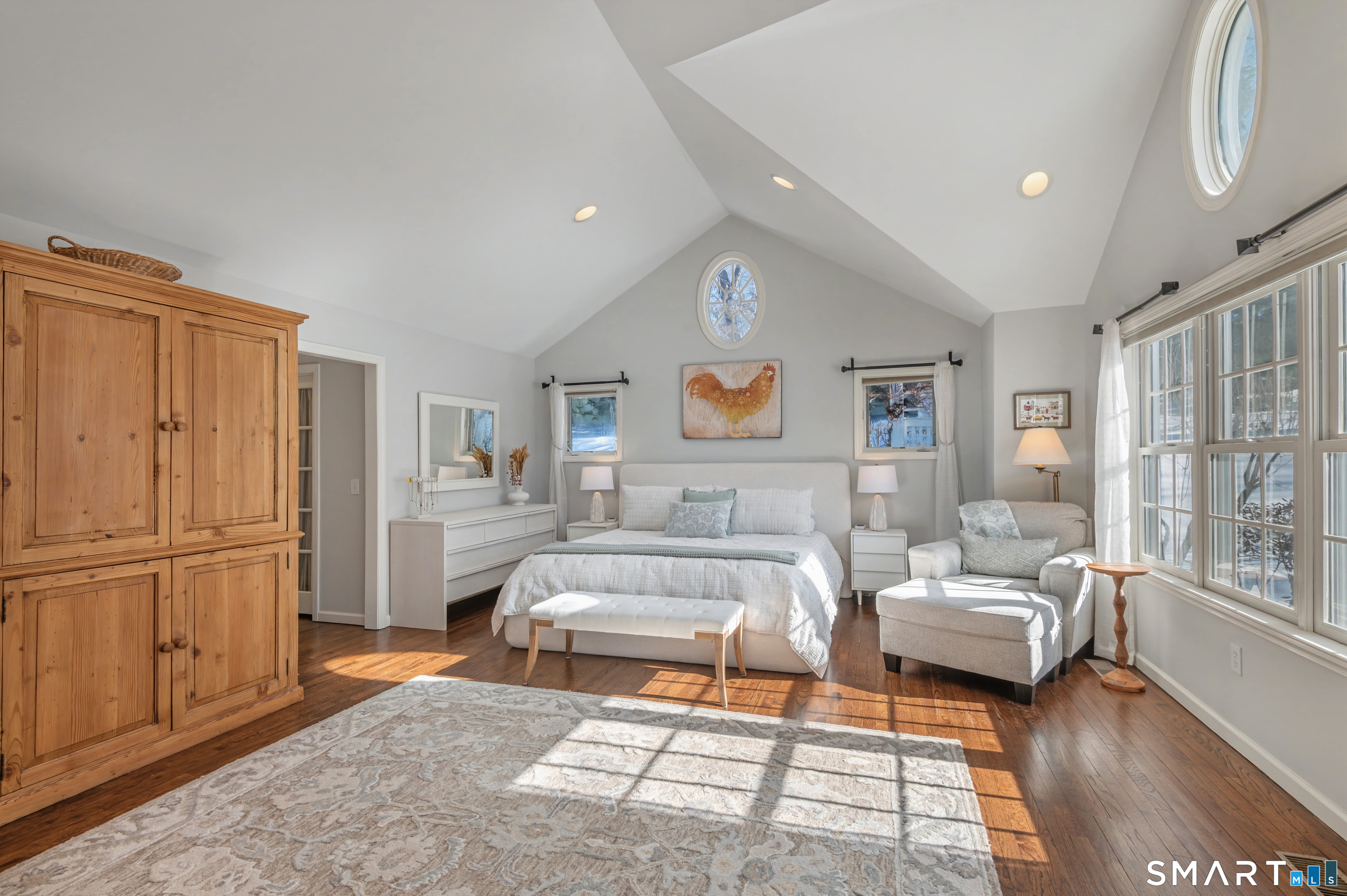6 Sycamore Lane Ridgefield, CT 06877 - Photo 16 of 39 a living room with furniture wooden floor and a rug