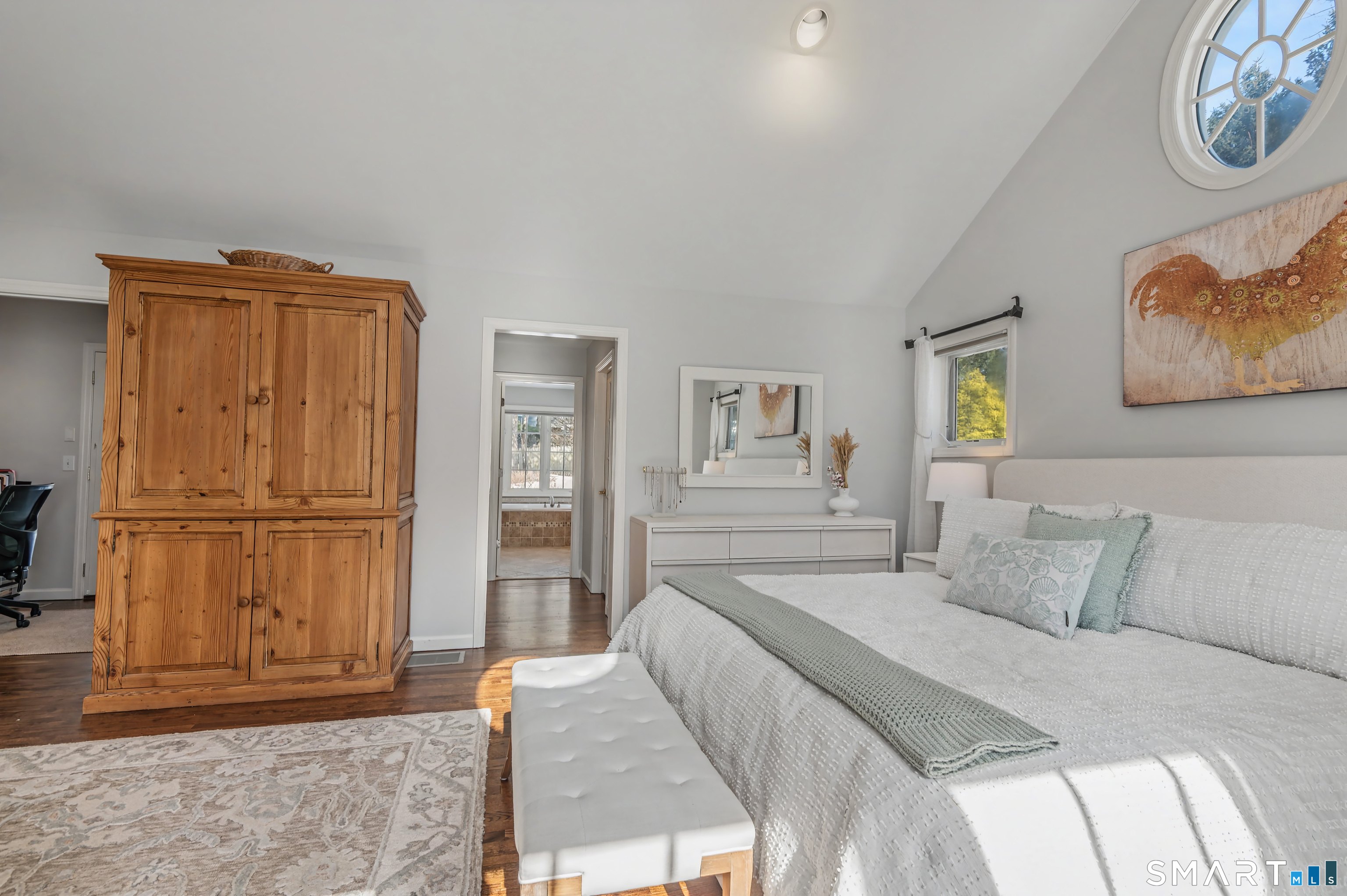 6 Sycamore Lane Ridgefield, CT 06877 - Photo 18 of 39 a bedroom with a bed and a refrigerator