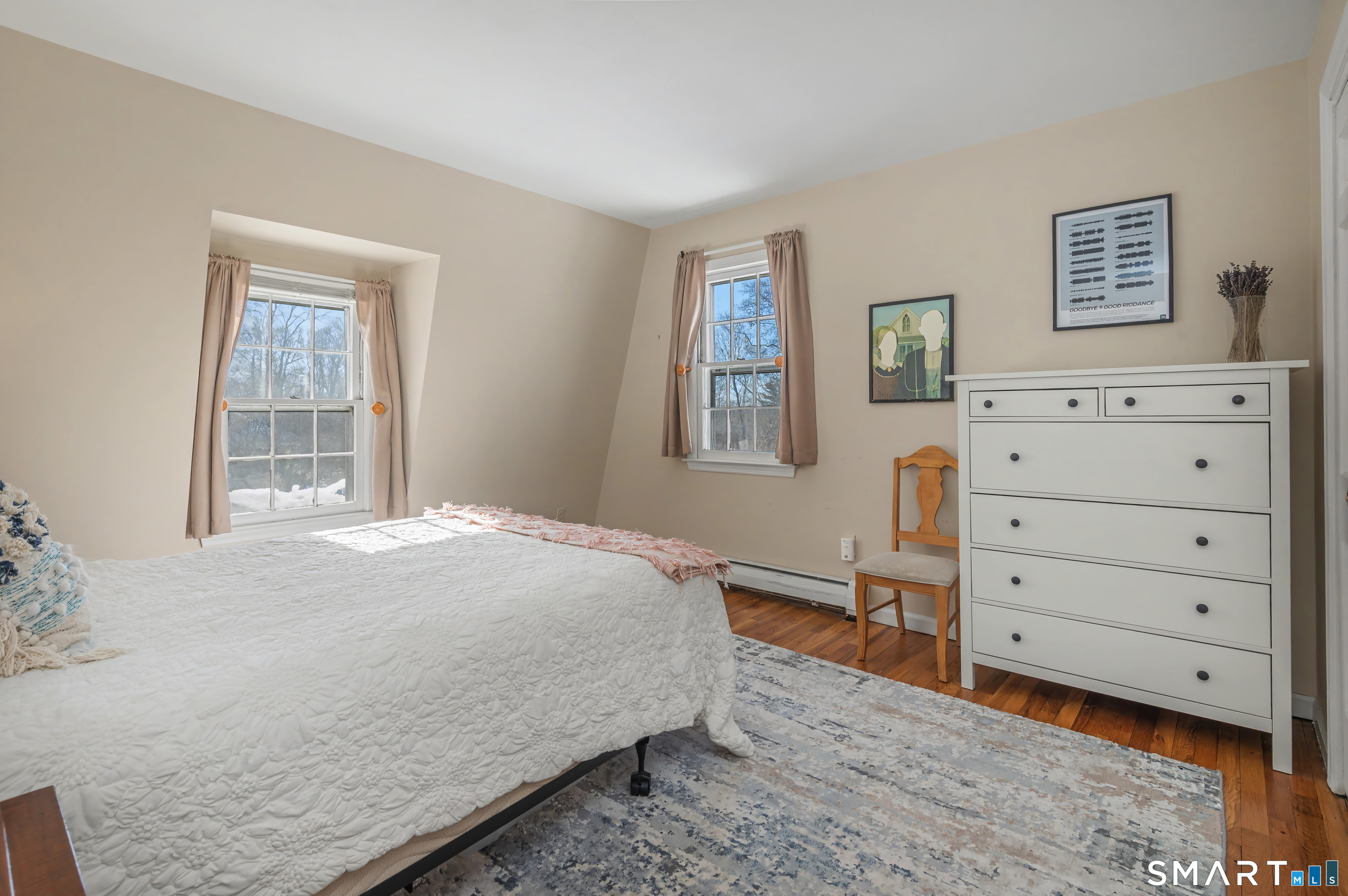 6 Sycamore Lane Ridgefield, CT 06877 - Photo 26 of 39 a bedroom with a bed and a window