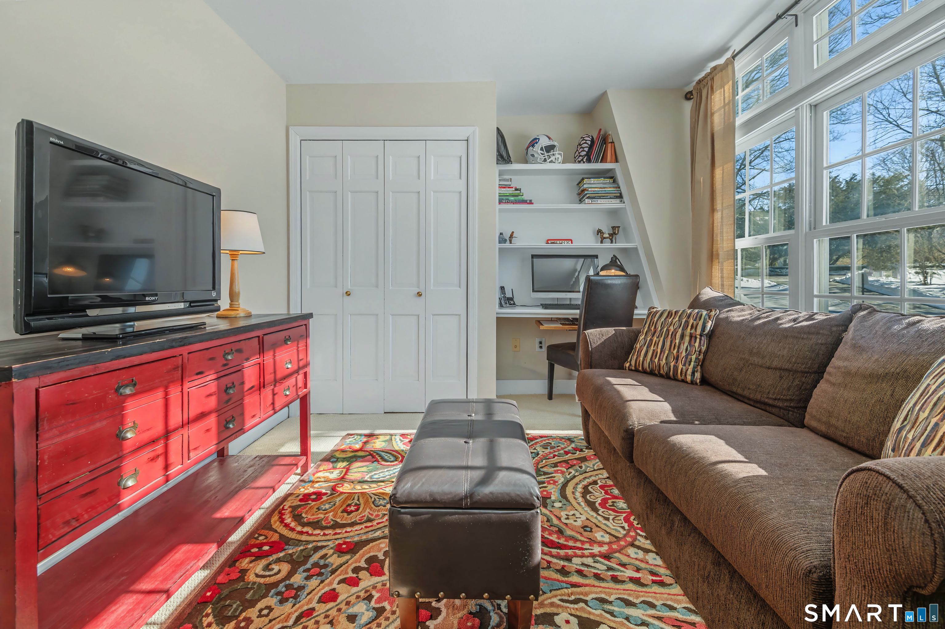 6 Sycamore Lane Ridgefield, CT 06877 - Photo 28 of 39 a living room with furniture and a flat screen tv