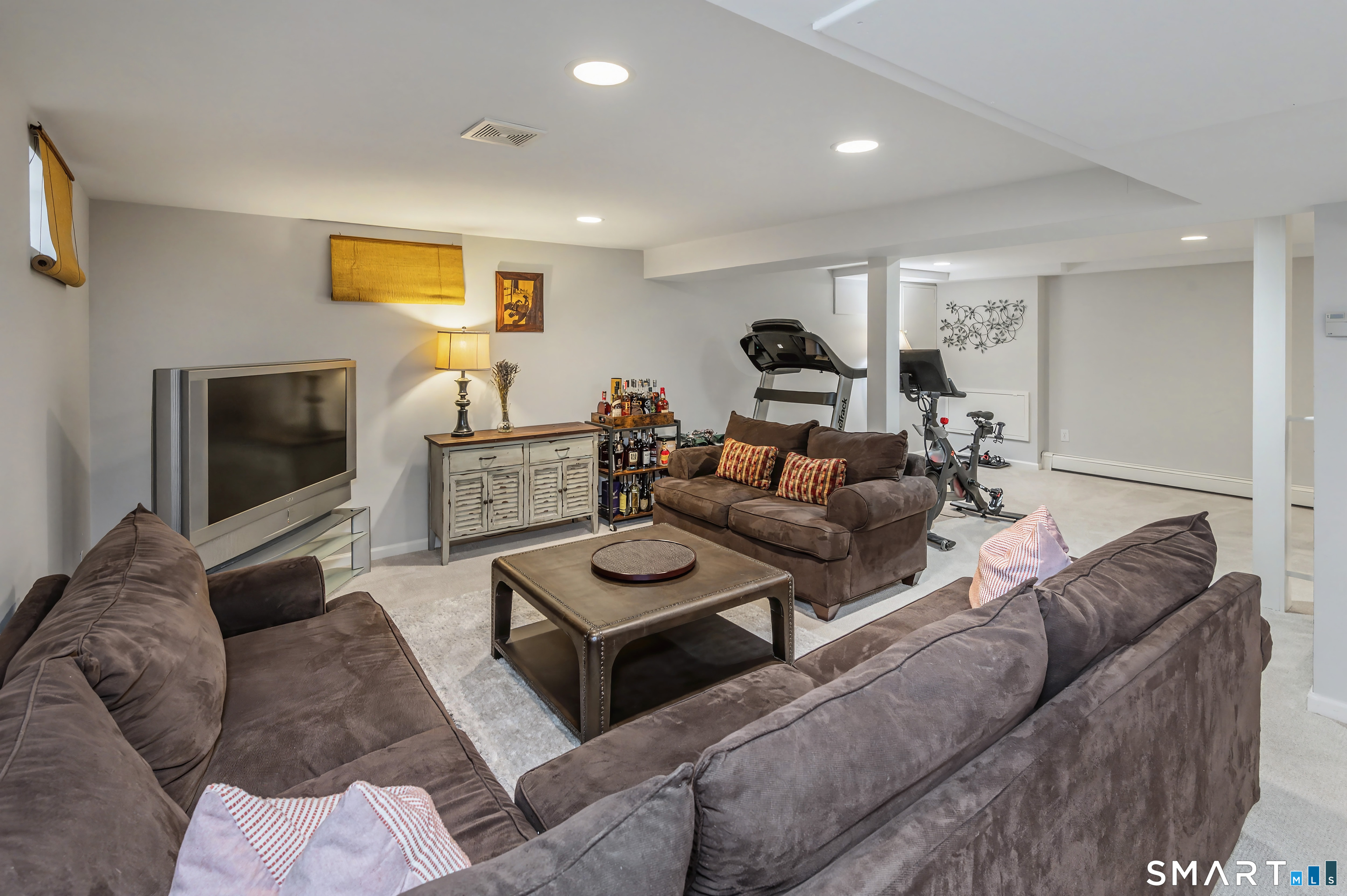 6 Sycamore Lane Ridgefield, CT 06877 - Photo 29 of 39 a living room with furniture and a flat screen tv