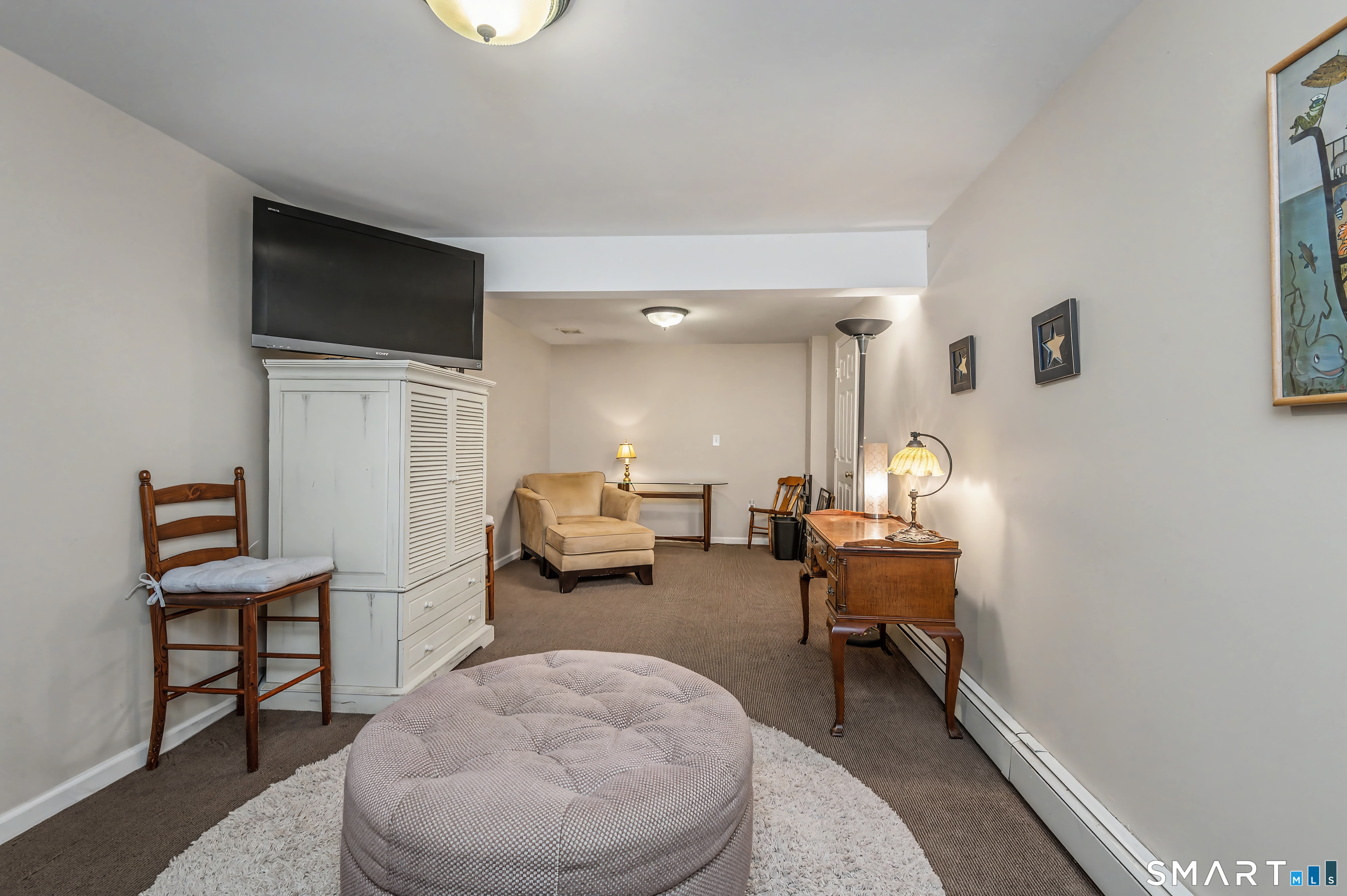 6 Sycamore Lane Ridgefield, CT 06877 - Photo 32 of 39 a living room with furniture and a table