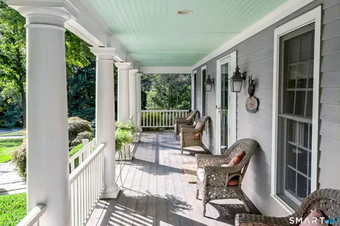 a view of balcony with furniture