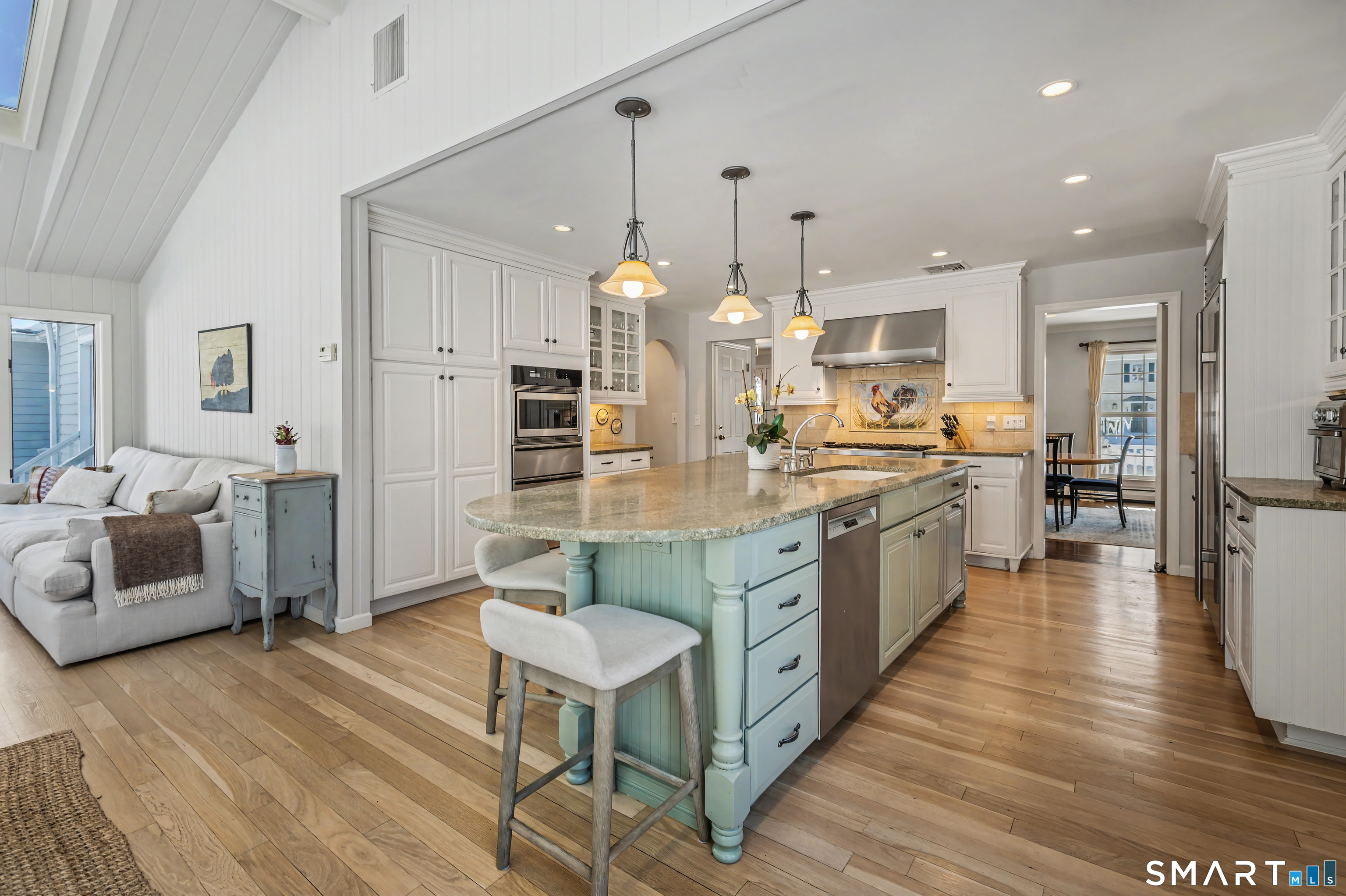 6 Sycamore Lane Ridgefield, CT 06877 - Photo 9 of 39 a large kitchen with a table and chairs
