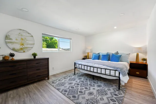 a bed room with a bed and a window