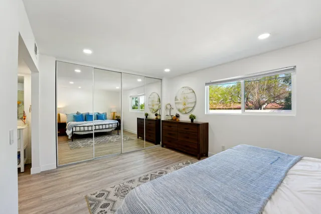 a bedroom with furniture and a window