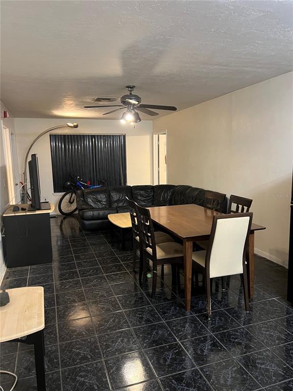 3800 Southwest 20th Avenue, Unit 204 Gainesville, FL 32607 - Photo 13 of 15 a view of a dining room with furniture